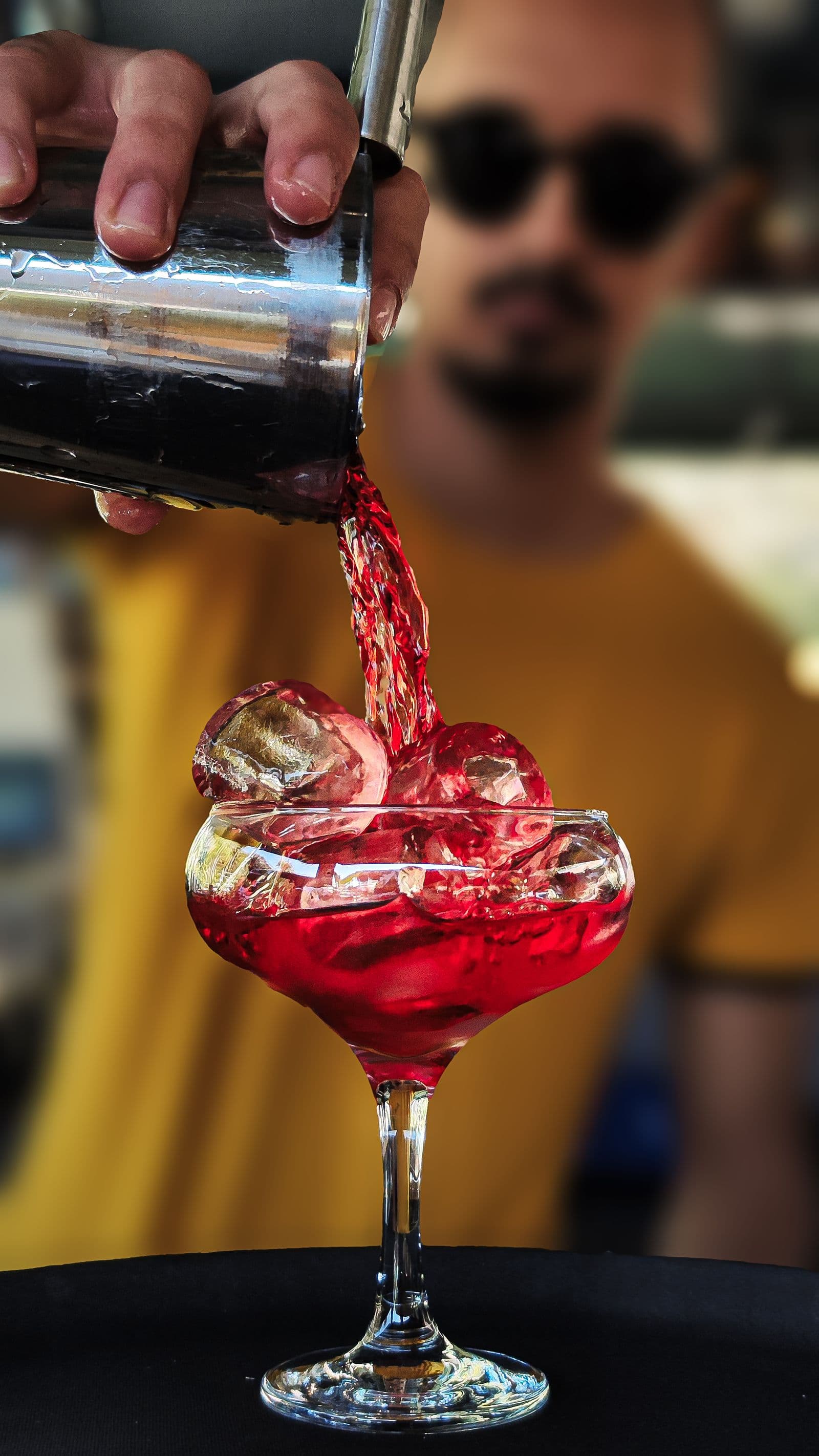 Mercury bartender pouring a cocktail at the bar on an evening