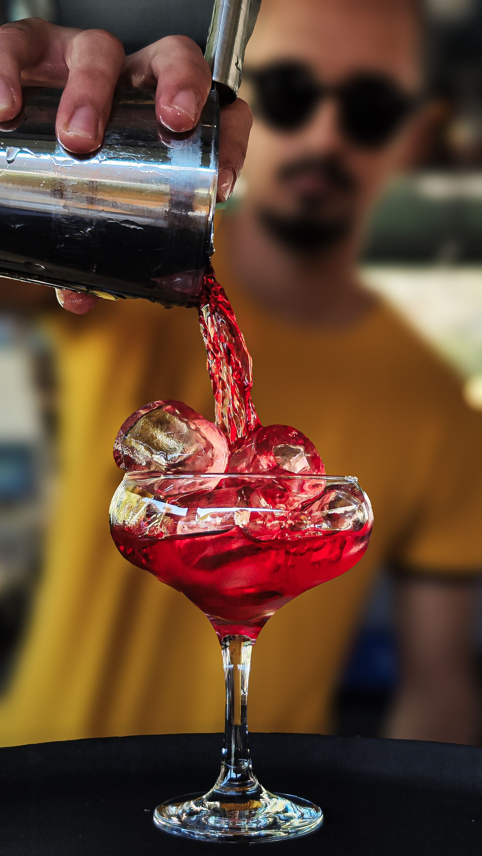 Mercury bartender pouring a cocktail at the bar on an evening