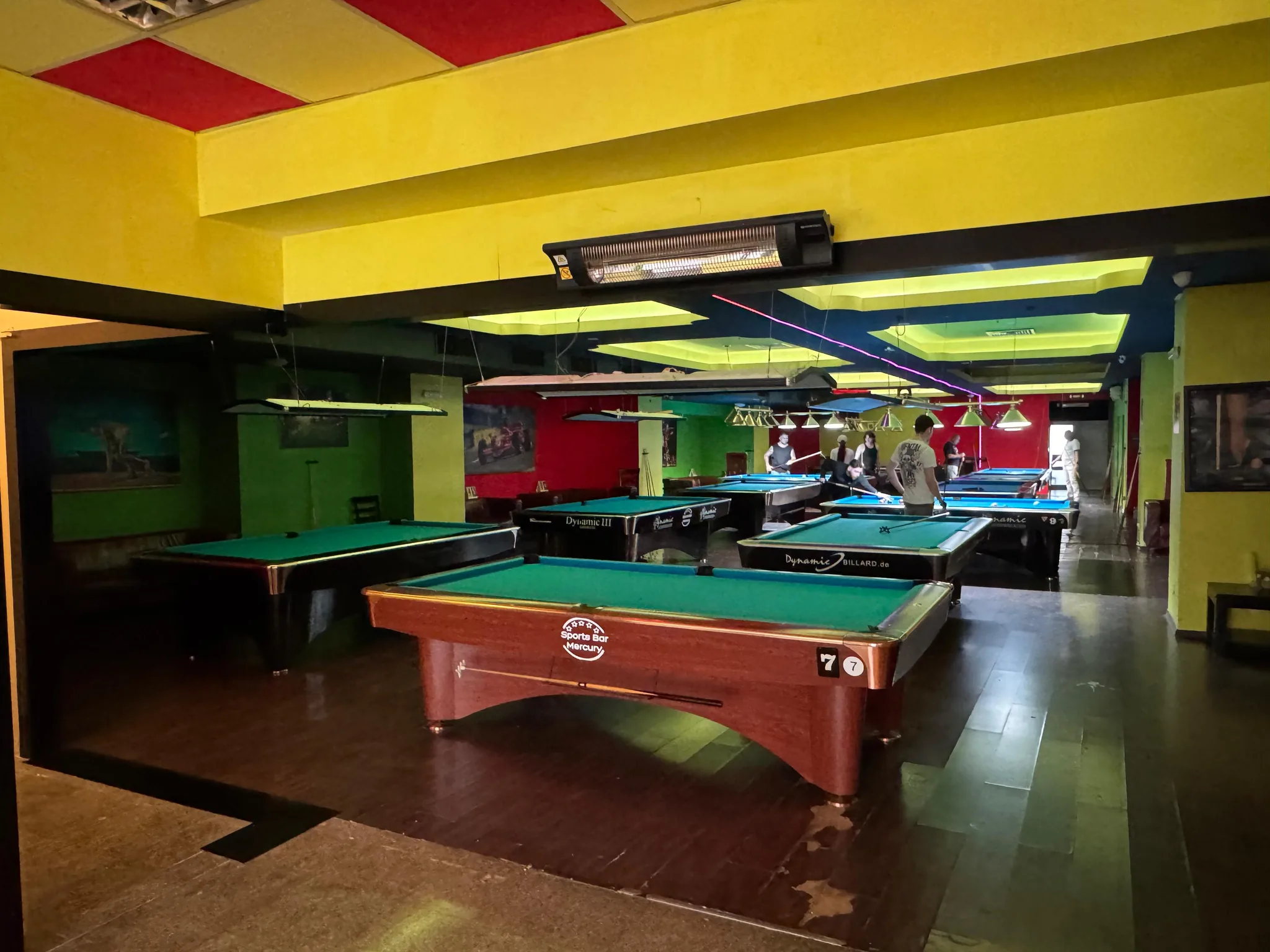 Wide view of Mercury venue with 12 billiard tables